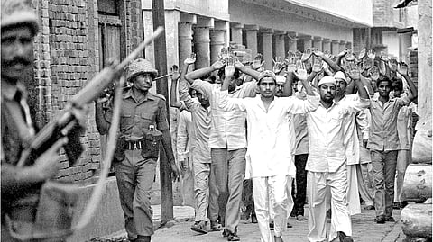Praveen Jain/Indian Express/ May 1987 Muslim men rounded up by Provincial Armed Constabulary during riots in villages near Meerut