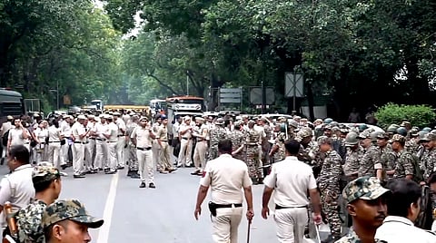 Security personnel keep vigil as heavy police deployment and entry restrictions are enforced at Jantar Mantar, in New Delhi, Saturday, Oct. 10, 2026.