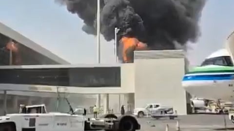 This image from video obtained and verified by AP shows thick black smoke and flames rising from a fire at King Khalid International Airport in Riyadh, Saudi Arabia, Friday, Oct. 9, 2026