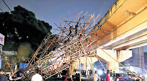 The decorative gate erected as part of Durga Puja pandal at Bomikhal collapsed following a thunderstorm in Bhubaneswar, on Friday  