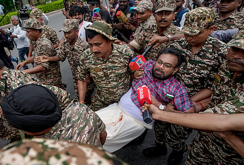 Police personnel detain CPI (M) MP John Brittas amid continued demonstration calls by the Cockroach Janta Party (CJP) demanding the resignation of Chief Election Commissioner (CEC) Gyanesh Kumar, in Connaught Place area, New Delhi, Sunday, Oct. 11, 2026.