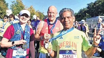 Dukhishyam Padhy showing his medal after completing Berlin Marathon