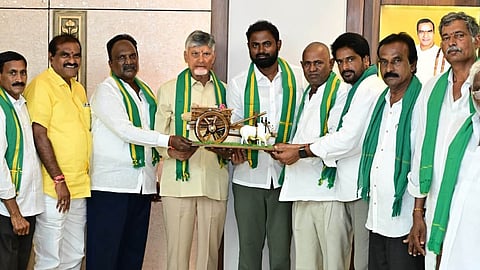 Irrigation Minister Nimmala Ramanaidu and farmers felicitate CM N Chandrababu Naidu at the Secretariat on Saturday.