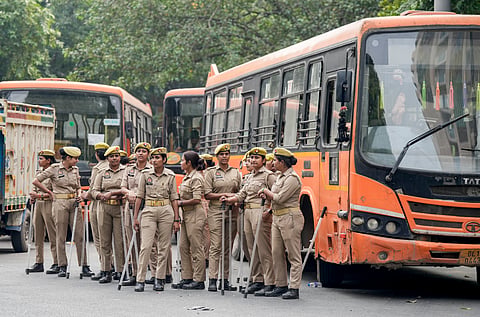Uttar Pradesh (UP) Police personnel stand guard and maintain security near Gurudwara Bangla Sahib amid continued demonstration calls by the Cockroach Janta Party (CJP) demanding the resignation of Chief Election Commissioner (CEC) Gyanesh Kumar, in New Delhi, Sunday, Oct. 11, 2026. 
