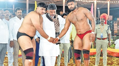 Chief Minister DK Shivakumar and the wrestlers at the Kushti (traditional wrestling) competition in Mysuru on Sunday evening.