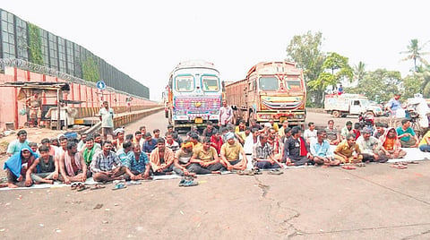 Truck drivers staging protest in front of Paradip Port gate on Monday.