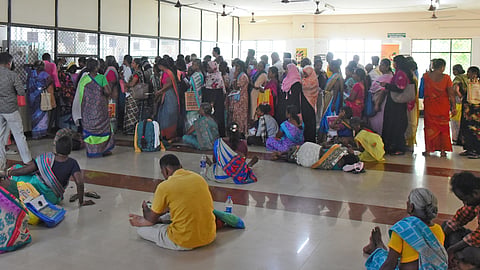 Patients waiting in a long queue at the Super Speciality Block of Mahatma Gandhi Memorial Hospital in Tiruchy to get medicines.
