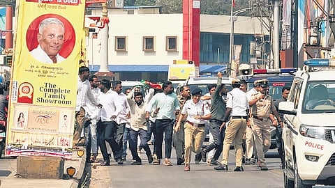 Youth Congress workers obstruct the vehicle of Union Minister of State for Railways V Somanna near the KSRTC bus stand in Shivamogga on Monday.