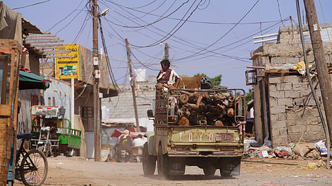 A truck loaded with firewood drives through the Al-Basateen neighborhood in Aden, Yemen, Tuesday, Oct. 13, 2026.