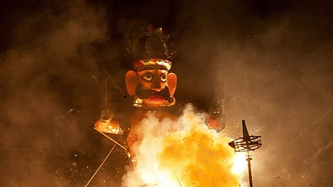 An effigy of demon king Ravana's brother burns during Dussehra.