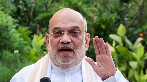 Union Home Minister Amit Shah speaks to the media regarding the results of the local body elections and by-elections and on the ongoing protests for the resignation of CEC Gyanesh Kumar and scrapping of SIR, in New Delhi, Tuesday, Oct. 13, 2026.