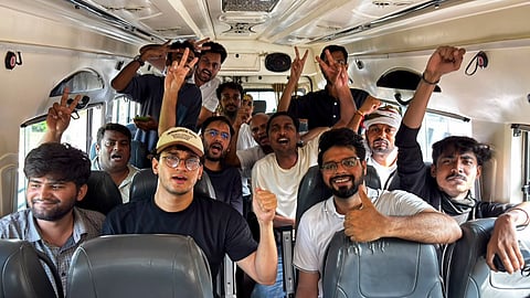 Cockroach Janta Party (CJP) chief spokesperson Saurav Das, national spokesperson Ashutosh Ranka, and other supporters inside a police bus after being detained for entering Jantar Mantar despite heavy barricading and a strong security presence, in New Delhi.
