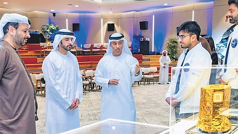 UAE Deputy Prime Minister and Minister of Defence Sheikh Hamdan bin Mohammed bin Rashid Al Maktoum (second from left) glancing at the 
Emirates Mission to the Asteroid Belt (EMA) Probe.