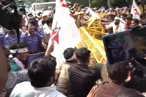 Police stop SFI, DYFI joint protest march from Firoz Shah Road to Jantar Mantar demanding resignation of CEC Gyanesh Kumar.
