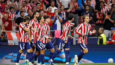 Atletico Madrid's Pablo Barrios (R) celebrates scoring his team's first goal during the UEFA Champions League football match between Club Atletico de Madrid and Manchester United at the Metropolitano stadium in Madrid on October 13, 2026.