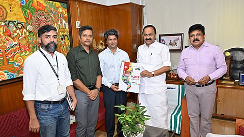 Chief Minister V D Satheesan releasing the cover page of Huddle Global 2026 annual report in Thiruvananthapuram on Tuesday.