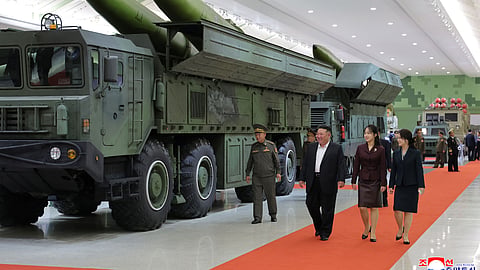 In this photo provided by the North Korean government, its leader Kim Jong Un, front left, his wife and their daughter tour a new defense museum called National Defence Revolution Museum at an undisclosed location in North Korea, Sunday, Oct. 11, 2026. 