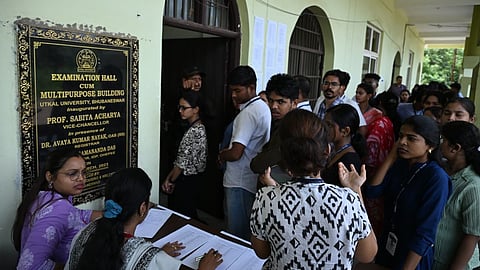 Students queue up outside a polling booth to vote in the Student Council Election at Utkal University in Bhubaneswar on Thursday.