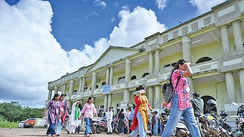 Students gather outside a polling booth to cast their votes during the student union elections at Utkal University.