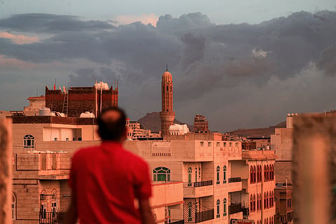 A man looks on as a minaret soars over the skyline of a neighbourhood, pictured at sunset in Yemen's Houthi-controlled capital Sanaa on October 13, 2026. (Representational image)