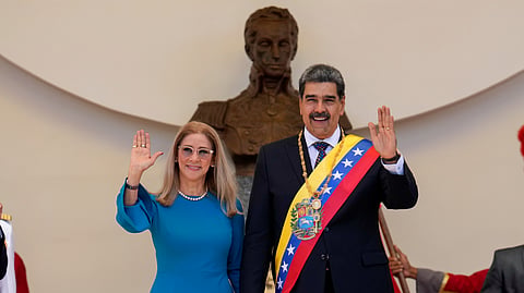 FILE - Venezuelan President Nicolas Maduro and his wife Cilia Flores wave after his swearing-in ceremony for a third term at the National Assembly in Caracas, Venezuela, on Jan. 10, 2025.