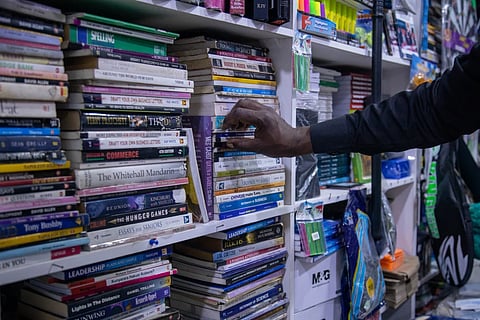 A customer browses for books at a bookstore in Harare, Zimbabwe, Wednesday, Oct. 14, 2026.