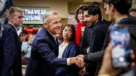 Canada Prime Minister, center left, meets with University of Calgary students in Calgary, Alberta, Thursday, Oct. 15, 2026. 