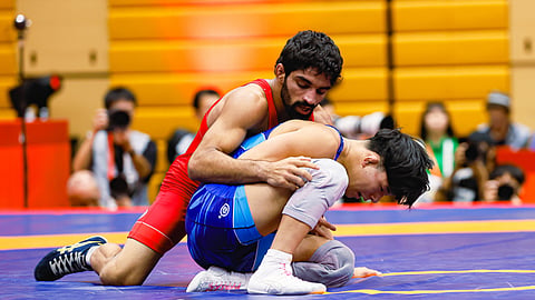 Aman Sehrawat (L) in action during the Asian Games in Nagoya, Japan