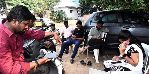 Booth Level Officers (BLO), Booth Level Agents (BLAs) contacting people over phone asking for documents to be submitted in response to notices issued as part of Special Intensive Revision, in Sangareddy, Telangana.