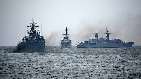 FILE - Romanian warships sail engulfed in smoke during a Romanian Navy led exercise outside Constanta, Romania, on April 16, 2024.