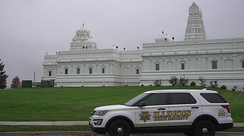 A security vehicle is parked outside of Sri Venkateswara Swami (Balaji) Temple in Aurora, Ill., Thursday, Oct. 15, 2026.