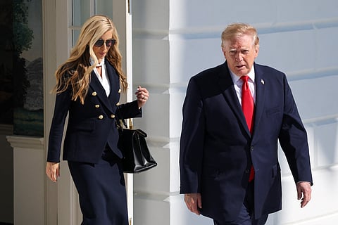  White House Press Secretary Katie Zacharia (L) joins U.S. President Donald Trump as he departs on the South Lawn of the White House on October 13, 2026 in Washington, DC