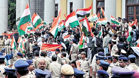 Police break up the Cockroach Janata Party’s ‘Tiranga March’ near Town Hall in Bengaluru on Friday.