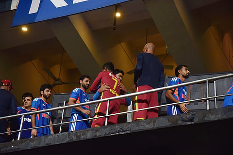 India and West Indies players shake hands after the fifth and final T20I in Bengaluru was called off due to rain on Saturday; The two teams shared the series honours