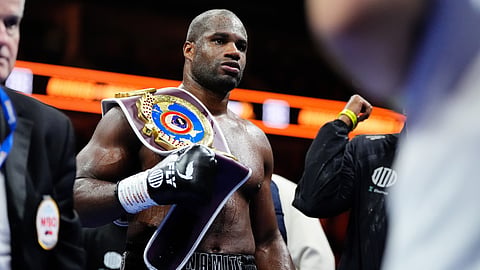 Boxer Daniel Dubois holds the belt after defeating Fabio Wardley in a WBO world heavyweight bout, Saturday, Oct. 17, 2025, in London. 