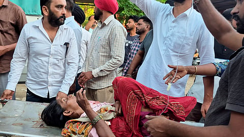 An injured victim being taken to a hospital after a car ran over workers on Lehragaga-Jakhal road, killing at least eight people and injuring 12 others, in Sangrur district, Punjab, Sunday, Oct. 18, 2026. The incident occurred near Alisher village when a group of more than 20 workers enrolled under Viksit Bharat Guarantee Rozgar and Ajeevika Mission Gramin (VB-G RAM G), several among them women, were engaged in some work. 