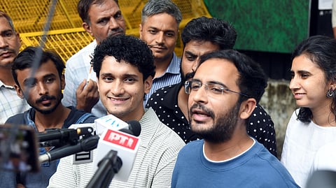 In this photo from Oct. 12, 2026, Cockroach Janta Party (CJP) leaders Ashutosh Ranka (R) and Saurav Das (L) speak to the media while leaving the Parliament Street police station after meeting the police representatives, in New Delhi on Monday.