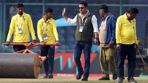 Ankit Datta (C) with ground staff at the Arun Jaitley Stadium in New Delhi