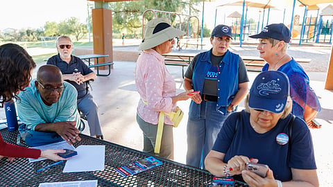 JoAnna Mendoza (D), standing second from right, an Arizona Congressional District 6 candidate, talks with campaign volunteers before a weekly neighbourhood canvass, Thursday, Oct. 15, 2026, in Oro Valley, Ariz.