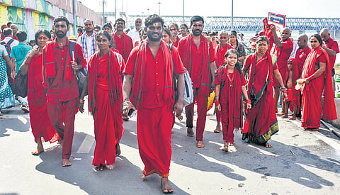 Bhavani devotees arrive to have darshan of Goddess Kanaka Durga in Sri Mahisasura Mardini Devi Avatar on Day 9 of Navaratri in Vijayawada.
