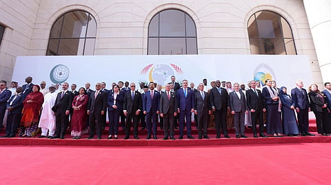Delegates pose during the 52nd session of the Council of Foreign Ministers of the Organization of Islamic Cooperation (OIC) meeting in Iraq's capital Baghdad on Sunday, October 18, 2026.