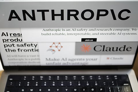Pages from the Anthropic website and the company's logos are displayed on a computer screen in New York on Thursday, Feb. 26, 2026.