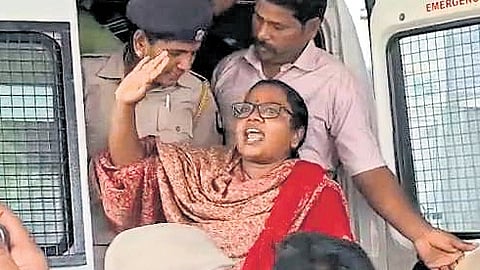 M Karthika, who contested the bypoll in Dharapuram, being arrested by the police early on Tuesday 