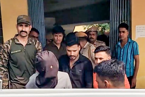  Three accused, including Ritik alias Roshan from Begusarai in Bihar and Rehan from Haryana's Sonipat, being brought out of Railway Colony Police Station after they were picked up from a train on Monday, a day after the firing at Bollywood actor Tiger Shroff's car in Mumbai's Juhu area, in Kota, Rajasthan, Tuesday, Oct. 20, 2026. The actor escaped relatively unhurt, while his driver and a bystander were injured. 