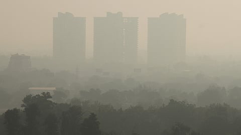 High-rise buildings remain shrouded amid hazy conditions, in Gurugram, Monday, Oct. 19, 2026.