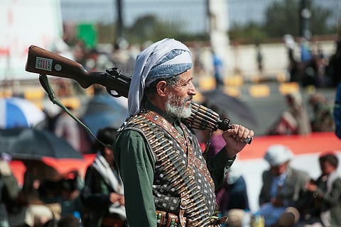A supporter of Yemen's Houthi rebels carries his rifle during a rally in support of the group in Sanaa, Yemen, Friday, Oct. 9, 2026.