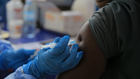 A healthcare worker administers a dose of the Ervebo vaccine against the Ebola virus in Beni, North Kivu province, eastern Congo, Friday, Oct. 16, 2026.