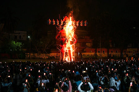 People watch an effigy of Demon King Ravana being burnt at Ravana Podi Ground at Nayapalli in Bhubaneswar on Wednesday. 