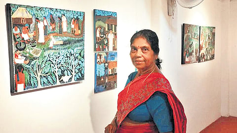 Madhavi K alongside her works
