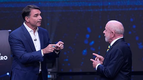 Opposition presidential candidate Sen. Flavio Bolsonaro, left, and Brazilian President Luiz Inacio Lula da Silva gesture toward each other during a televised presidential debate one week before the presidential runoff election in Sao Paulo, Brazil, Sunday, Oct. 18, 2026.